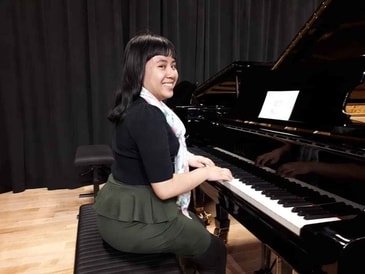 Erica playing the $10,000 grand piano